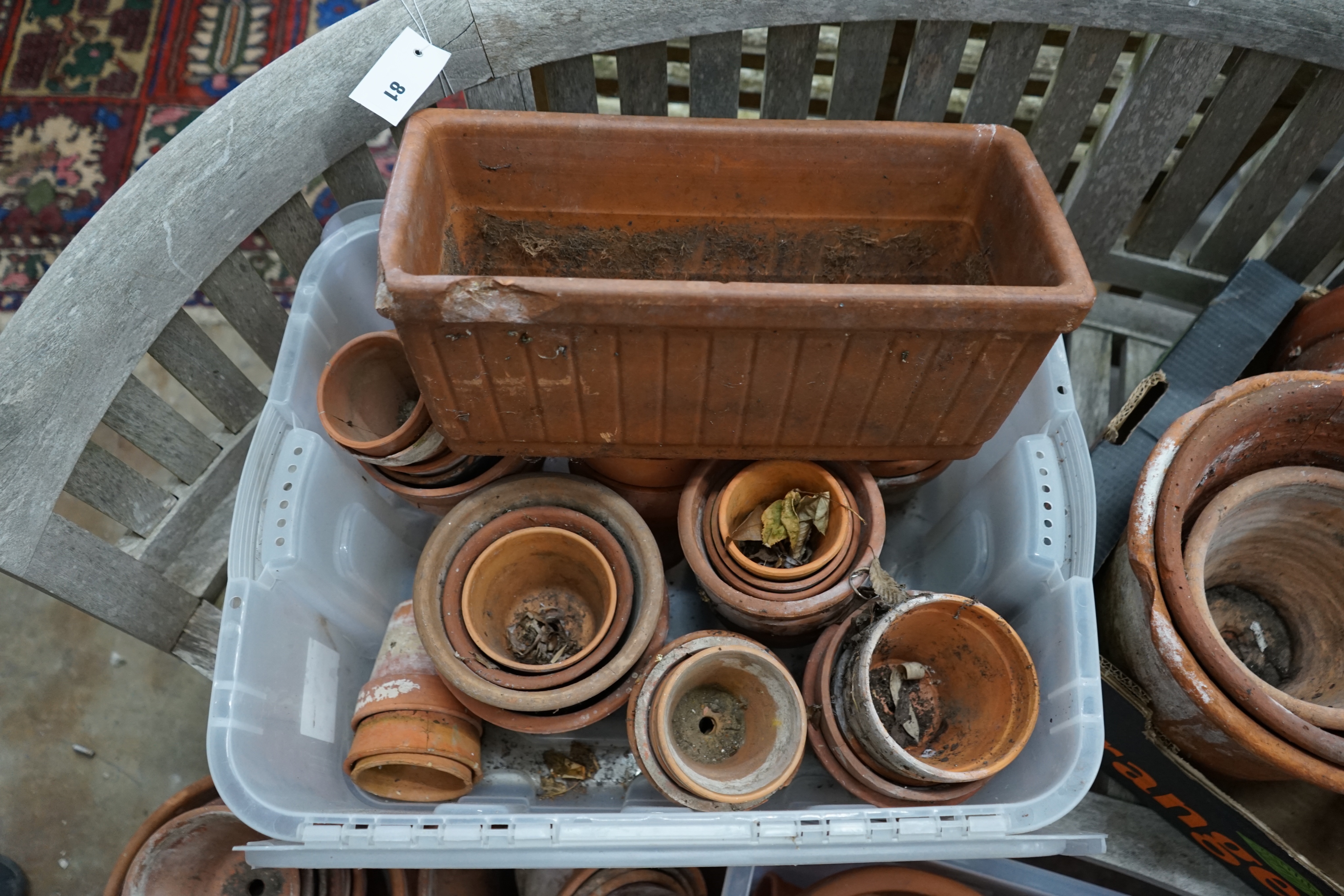 Approximately 100 terracotta garden pots, largest diameter 33cm height 28cm